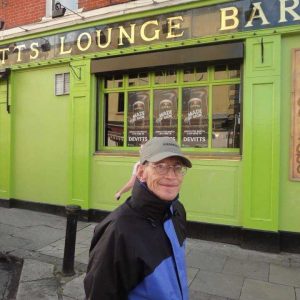 Elias in Ireland outside a pub called Devit's Lounge